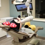 mini mouse in a dental chair